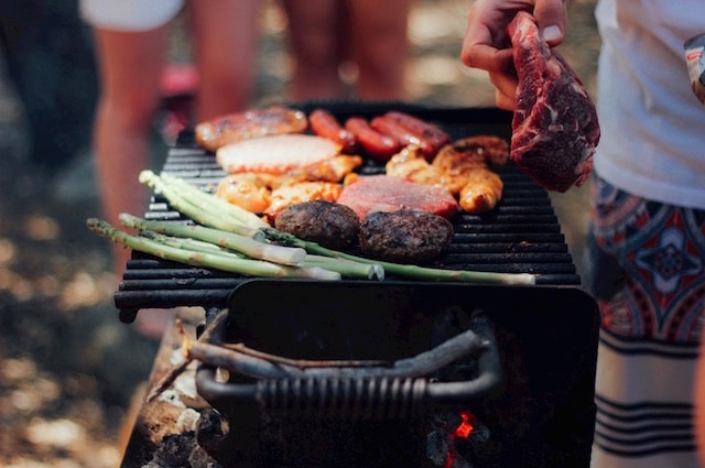 33 Great Gifts for Barbecue Lovers, image of a grill, cooking various meats and vegetables